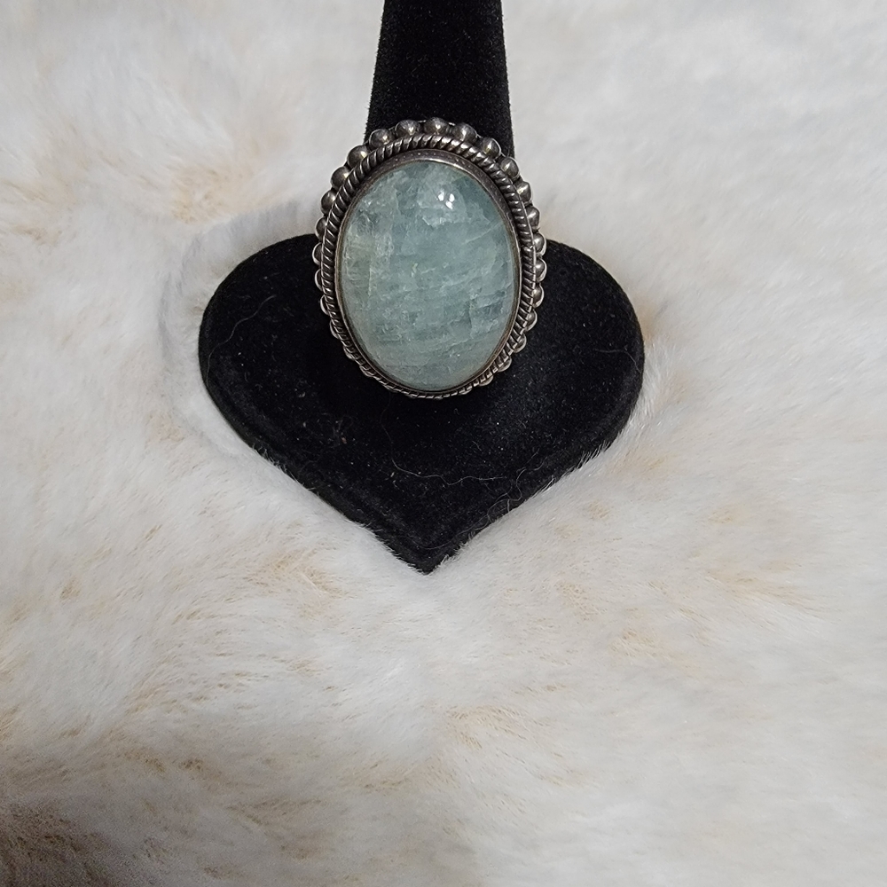 Beautiful green stone ring with a big presence.  Set in beaded sterling.  Size 7